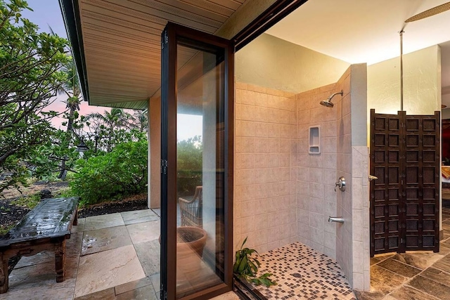 bathroom with tiled shower