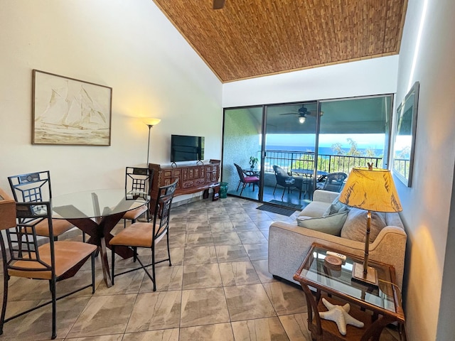 living room with high vaulted ceiling and wooden ceiling