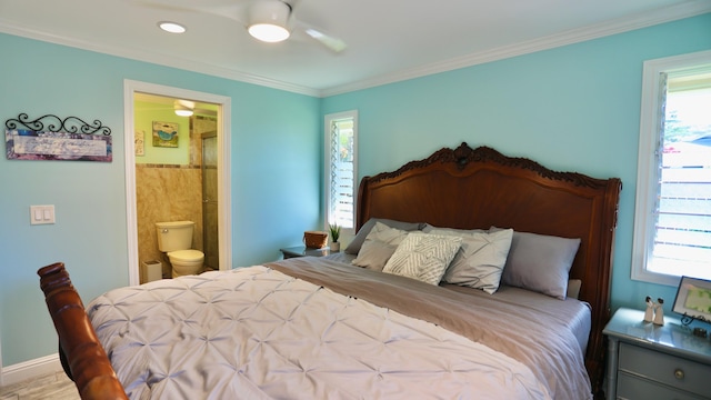 bedroom featuring multiple windows, ensuite bathroom, ceiling fan, and crown molding