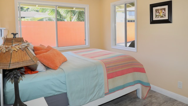 bedroom featuring access to exterior and multiple windows