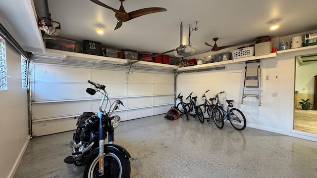 garage featuring a garage door opener and ceiling fan