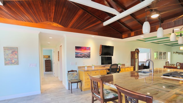 dining space with sink, vaulted ceiling with beams, light hardwood / wood-style floors, and wood ceiling