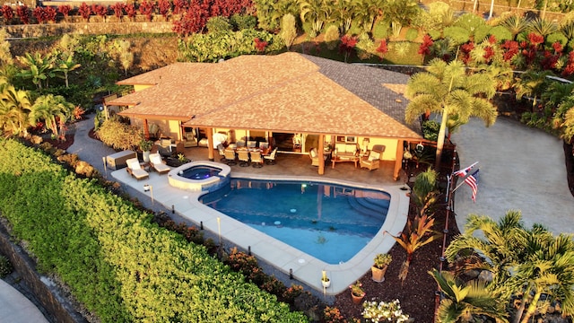 view of swimming pool with a patio area, an in ground hot tub, and an outdoor hangout area