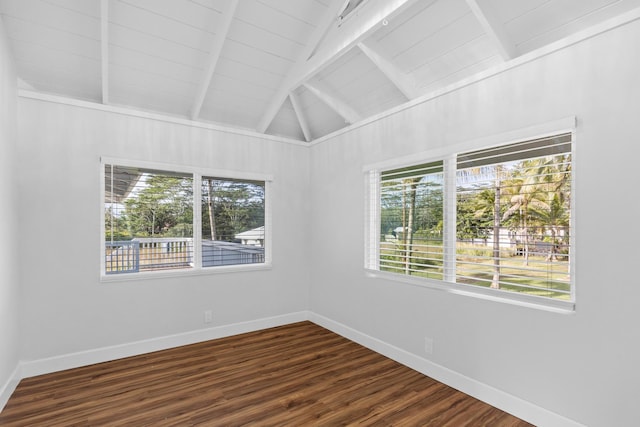 empty room with vaulted ceiling with beams, wood ceiling, and hardwood / wood-style floors