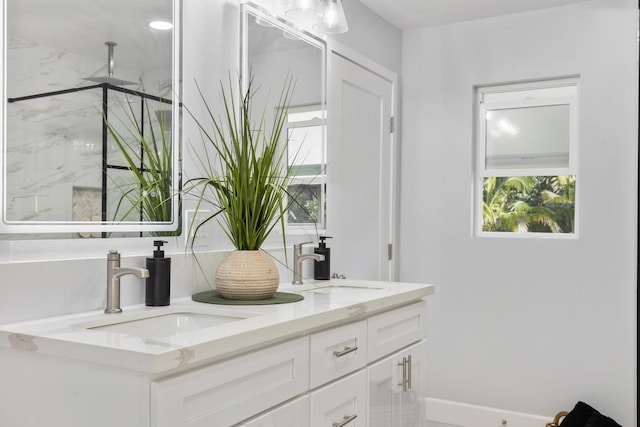 bathroom with vanity and tiled shower