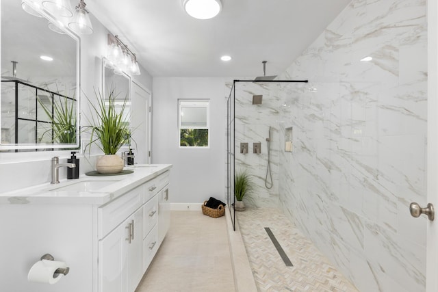 bathroom with vanity, tile patterned flooring, and walk in shower