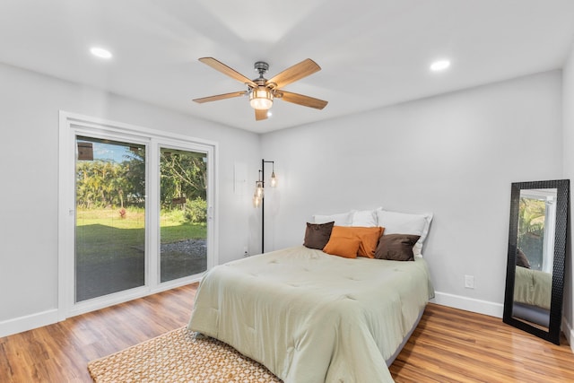 bedroom featuring ceiling fan, access to exterior, and light hardwood / wood-style flooring