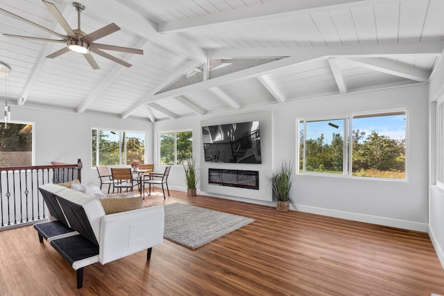 living room featuring hardwood / wood-style flooring, vaulted ceiling with beams, and ceiling fan