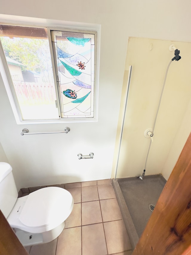 bathroom featuring tile patterned flooring and toilet