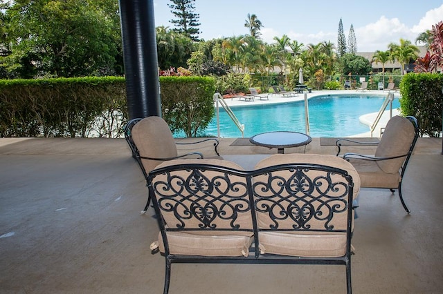 view of swimming pool featuring a patio area