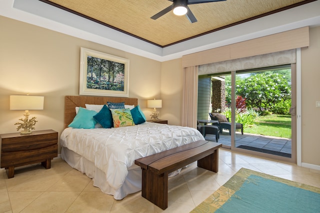 tiled bedroom with access to exterior, ceiling fan, and a tray ceiling