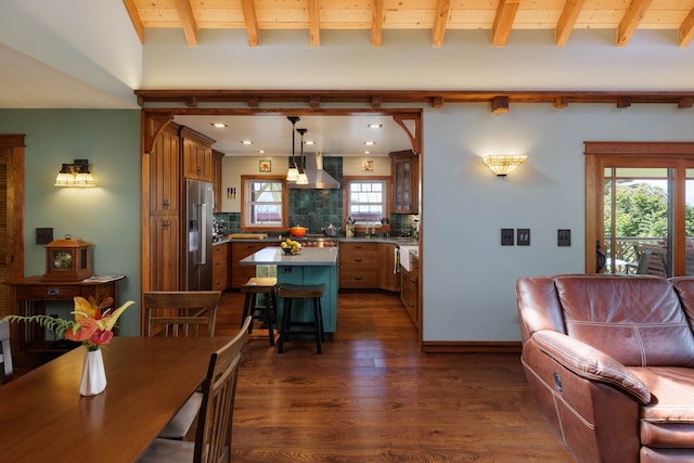 dining area featuring beam ceiling, wood ceiling, and dark wood-type flooring