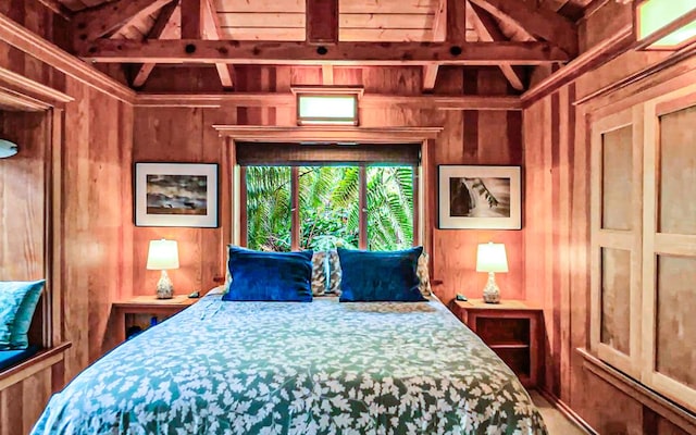 bedroom featuring wooden walls