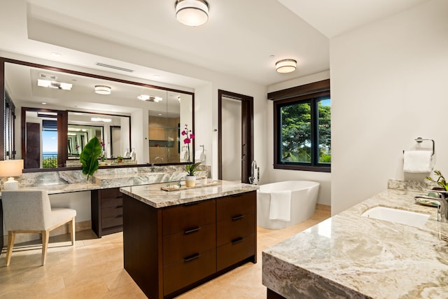 bathroom featuring independent shower and bath, vanity, and tile patterned flooring