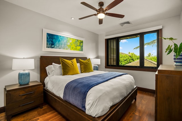 bedroom featuring ceiling fan and dark hardwood / wood-style flooring