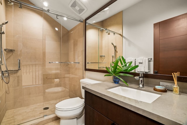 bathroom with vanity, lofted ceiling, toilet, and walk in shower