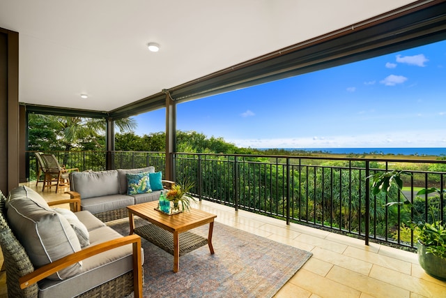 sunroom / solarium with a water view