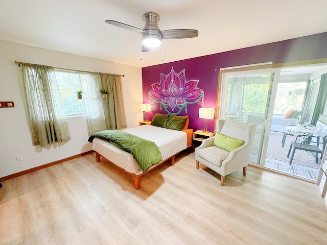 bedroom featuring access to exterior, ceiling fan, and light hardwood / wood-style flooring