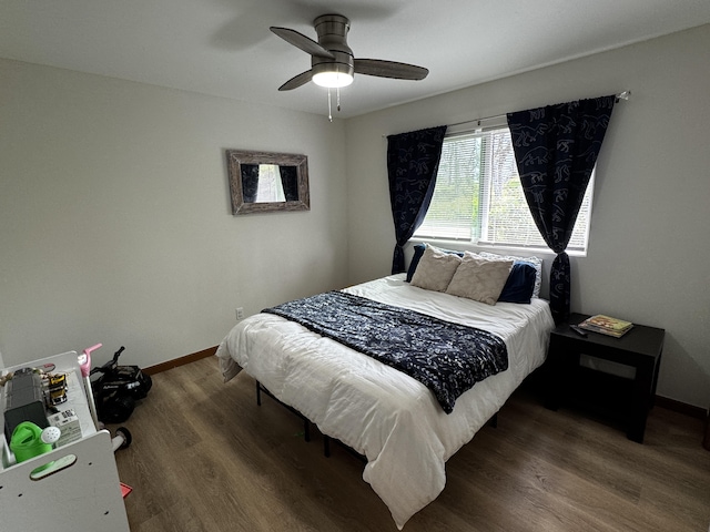 bedroom featuring dark hardwood / wood-style floors and ceiling fan