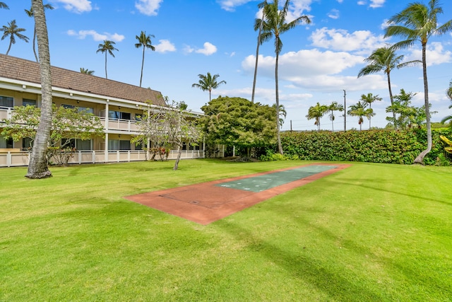 view of home's community featuring a lawn