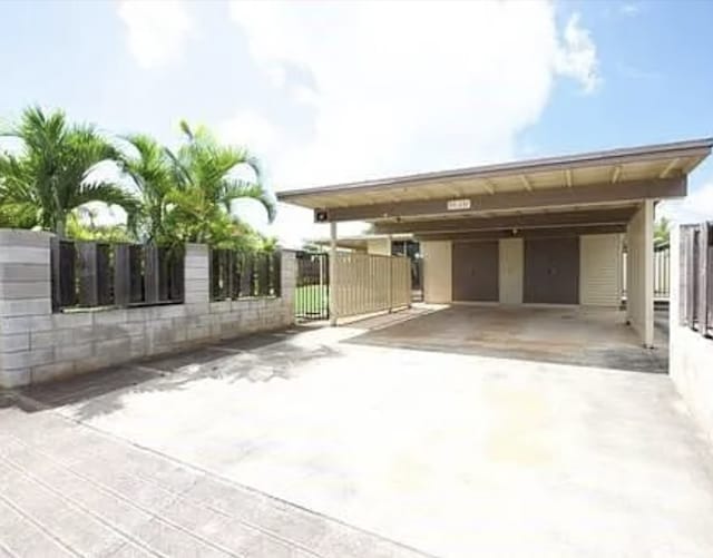 view of parking with a carport