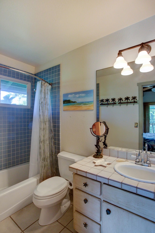 full bathroom with tile patterned floors, vanity, toilet, and shower / bath combo with shower curtain