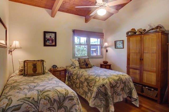 bedroom featuring vaulted ceiling with beams, ceiling fan, dark wood-type flooring, and wood ceiling