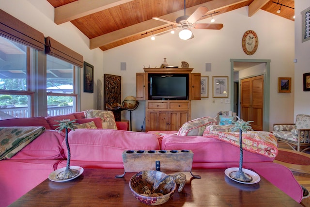 living room with beamed ceiling, ceiling fan, rail lighting, and high vaulted ceiling