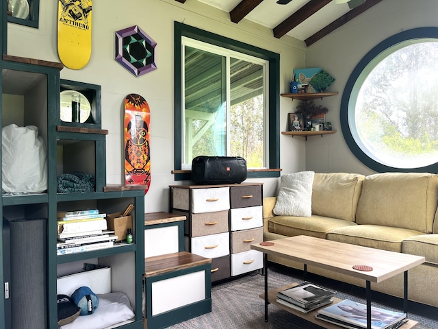 interior space featuring lofted ceiling with beams