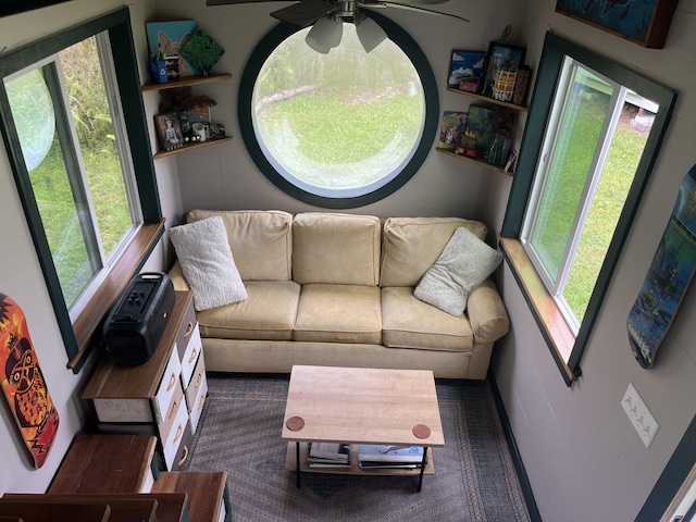 living room featuring a ceiling fan