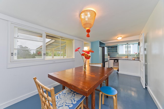 dining room with built in features and sink