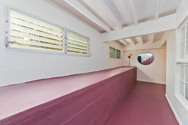 interior space featuring beam ceiling