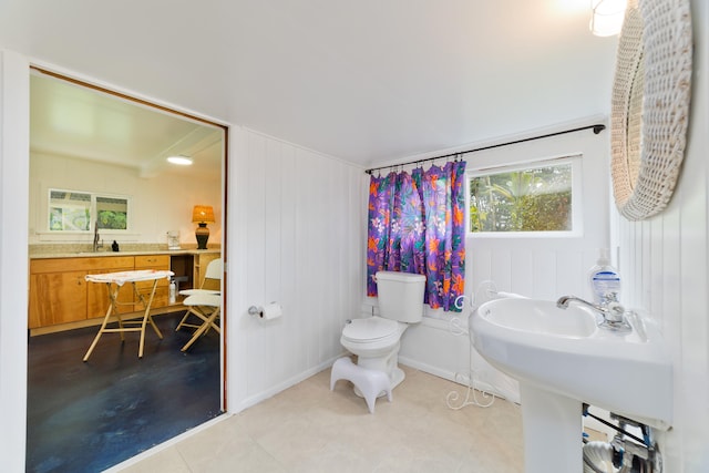 bathroom featuring sink and toilet