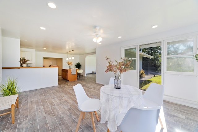 dining room featuring ceiling fan and light hardwood / wood-style flooring