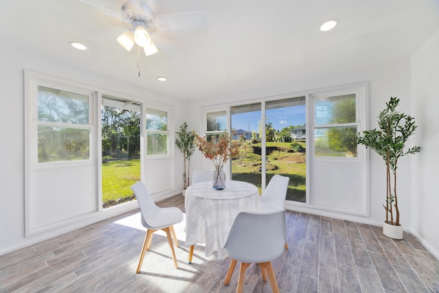 sunroom featuring ceiling fan