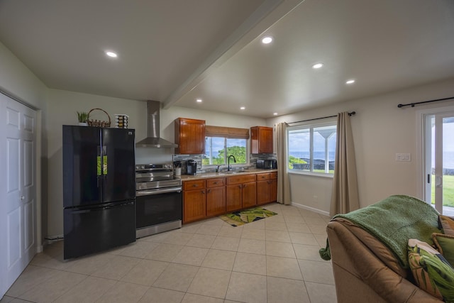 kitchen with tasteful backsplash, wall chimney exhaust hood, sink, black appliances, and beam ceiling