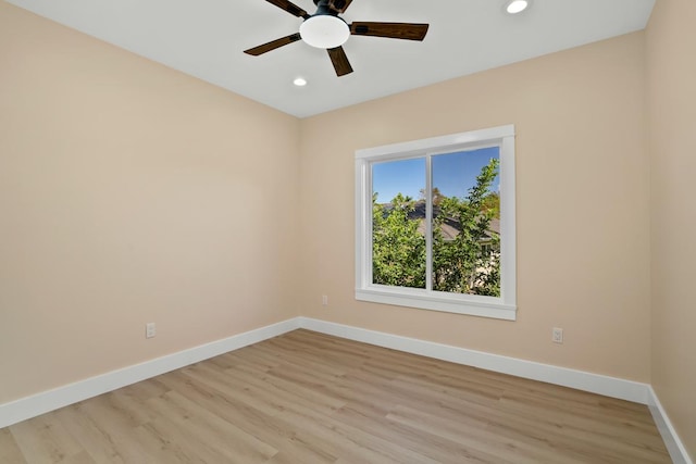 unfurnished room with light wood finished floors, baseboards, a ceiling fan, and recessed lighting