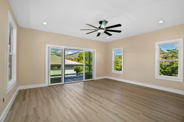 spare room with ceiling fan, light wood-style floors, recessed lighting, and baseboards