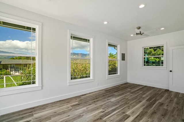 unfurnished room with recessed lighting, ceiling fan, baseboards, and wood finished floors