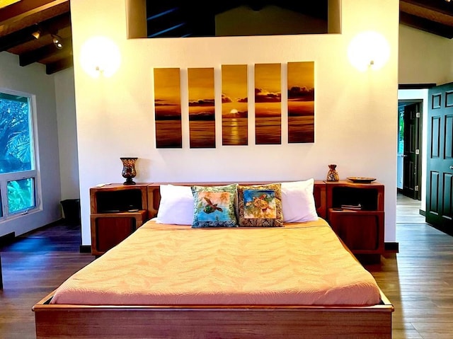 bedroom featuring lofted ceiling with beams and dark hardwood / wood-style floors