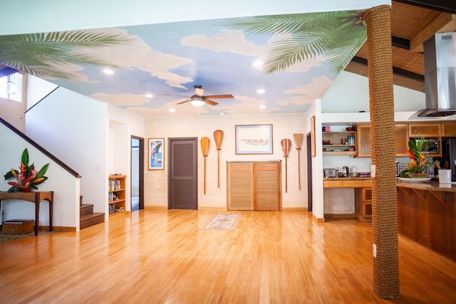 foyer entrance featuring wood-type flooring and ceiling fan