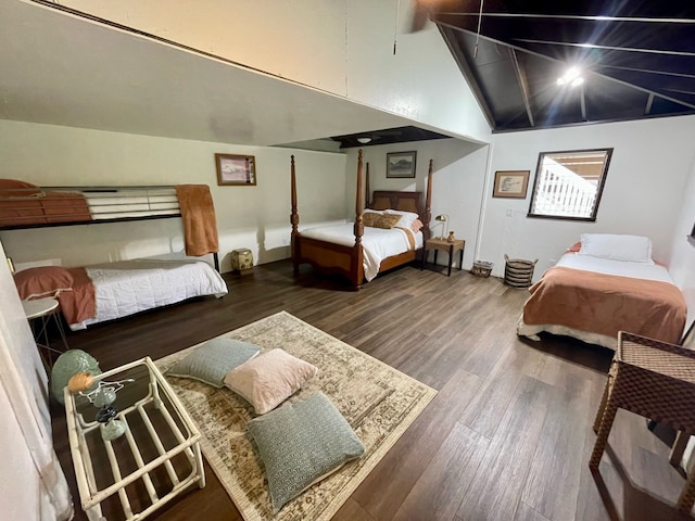 bedroom featuring wood-type flooring and lofted ceiling