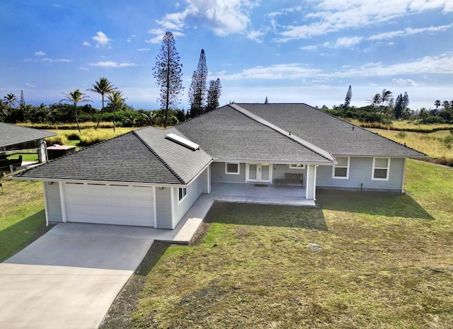 ranch-style house with a garage and a front yard