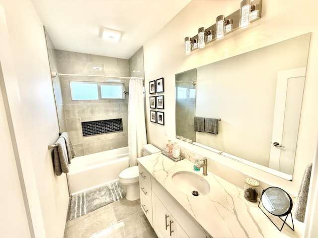 full bathroom featuring tile patterned floors, shower / tub combo with curtain, vanity, and toilet