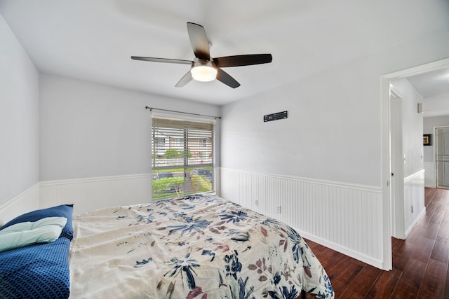 bedroom featuring dark hardwood / wood-style flooring and ceiling fan