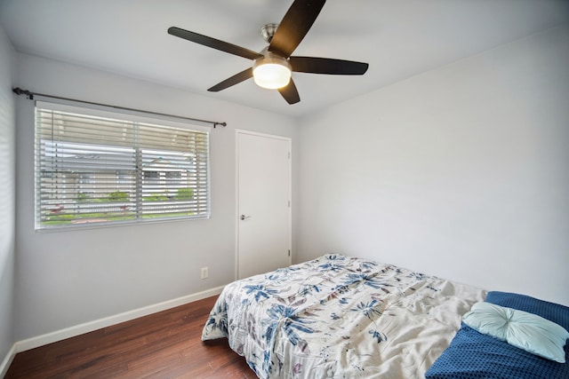 bedroom featuring ceiling fan and dark hardwood / wood-style floors