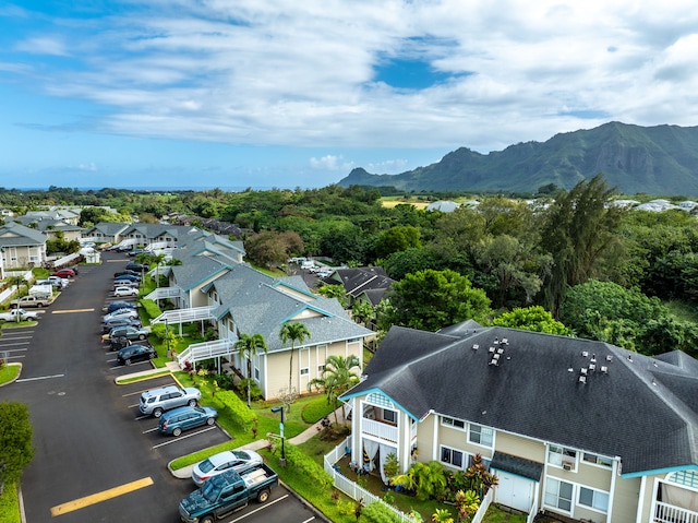 birds eye view of property with a mountain view