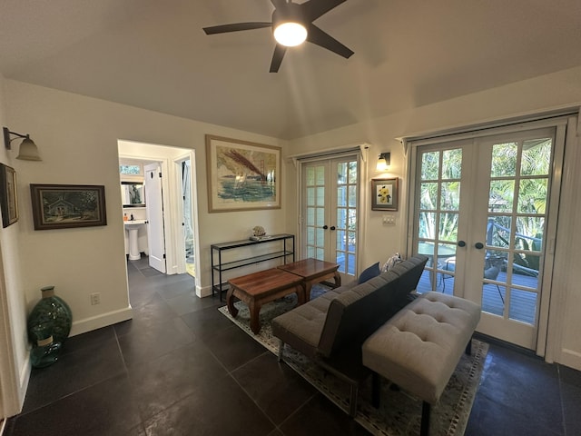 living room with ceiling fan, lofted ceiling, french doors, and sink