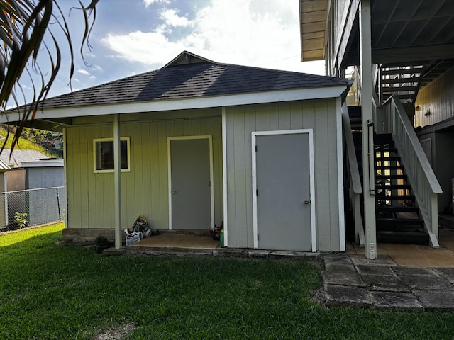 view of outdoor structure featuring a lawn