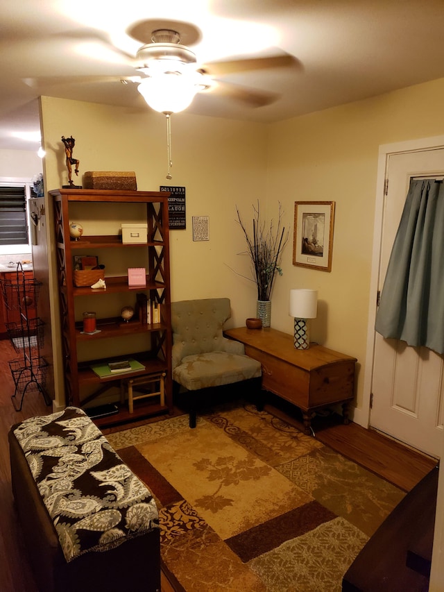 sitting room featuring ceiling fan